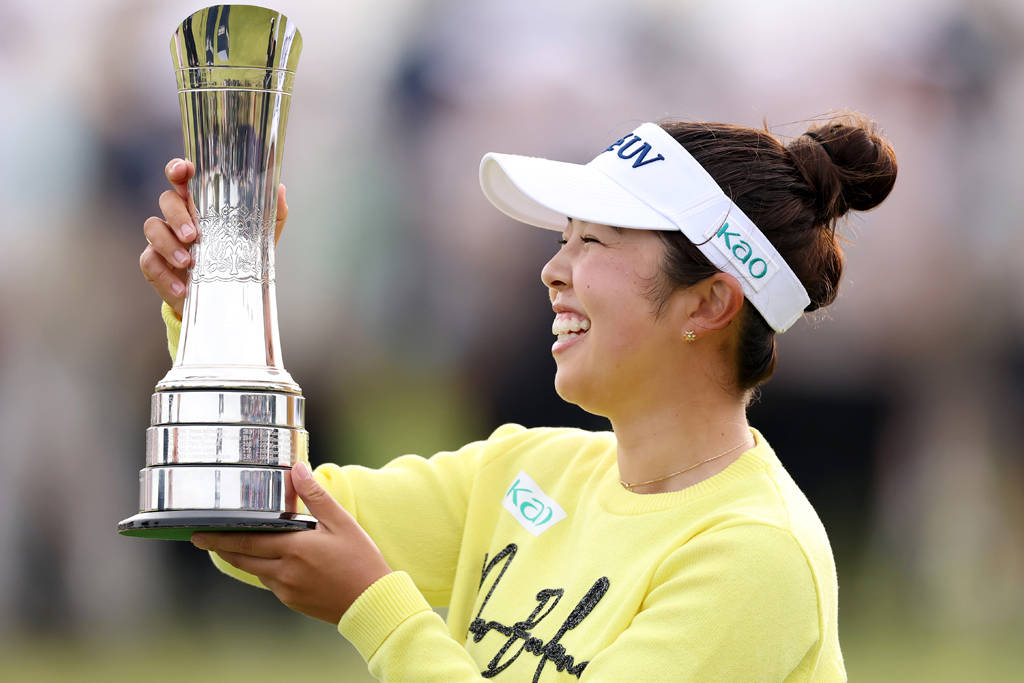 Miyu Yamashita holds aloft the trophy after winning the AIG Women